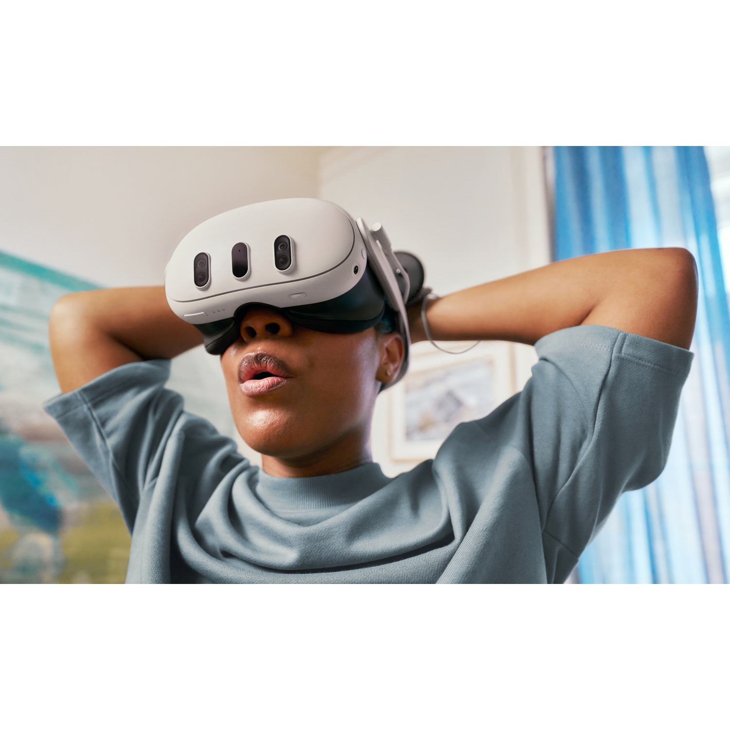 Woman wearing VR headset, looking upwards with a surprised expression.