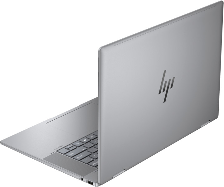 A silver HP laptop, open, showing the keyboard and the HP logo on the back.