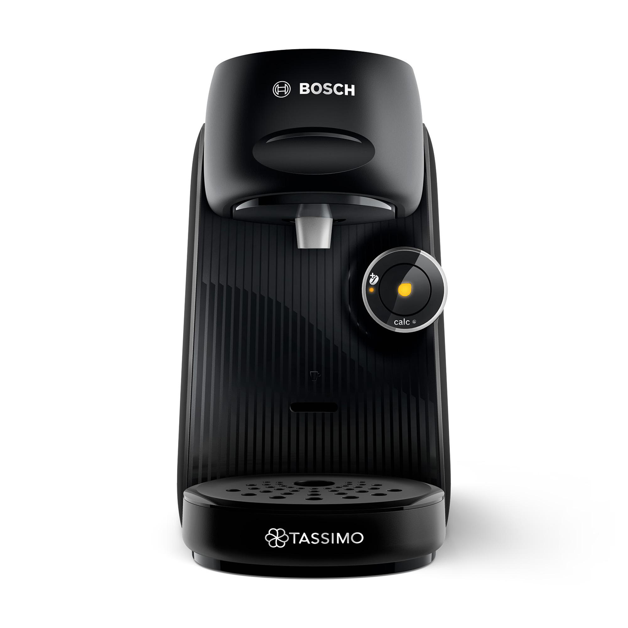 Eine schwarze Tassimo-Kaffeemaschine mit schwarzem Sockel und gelber Lichtanzeige. Weißer Hintergrund.