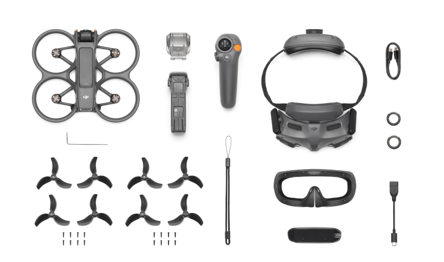 Dron DJI Avata i jego akcesoria na białej powierzchni.