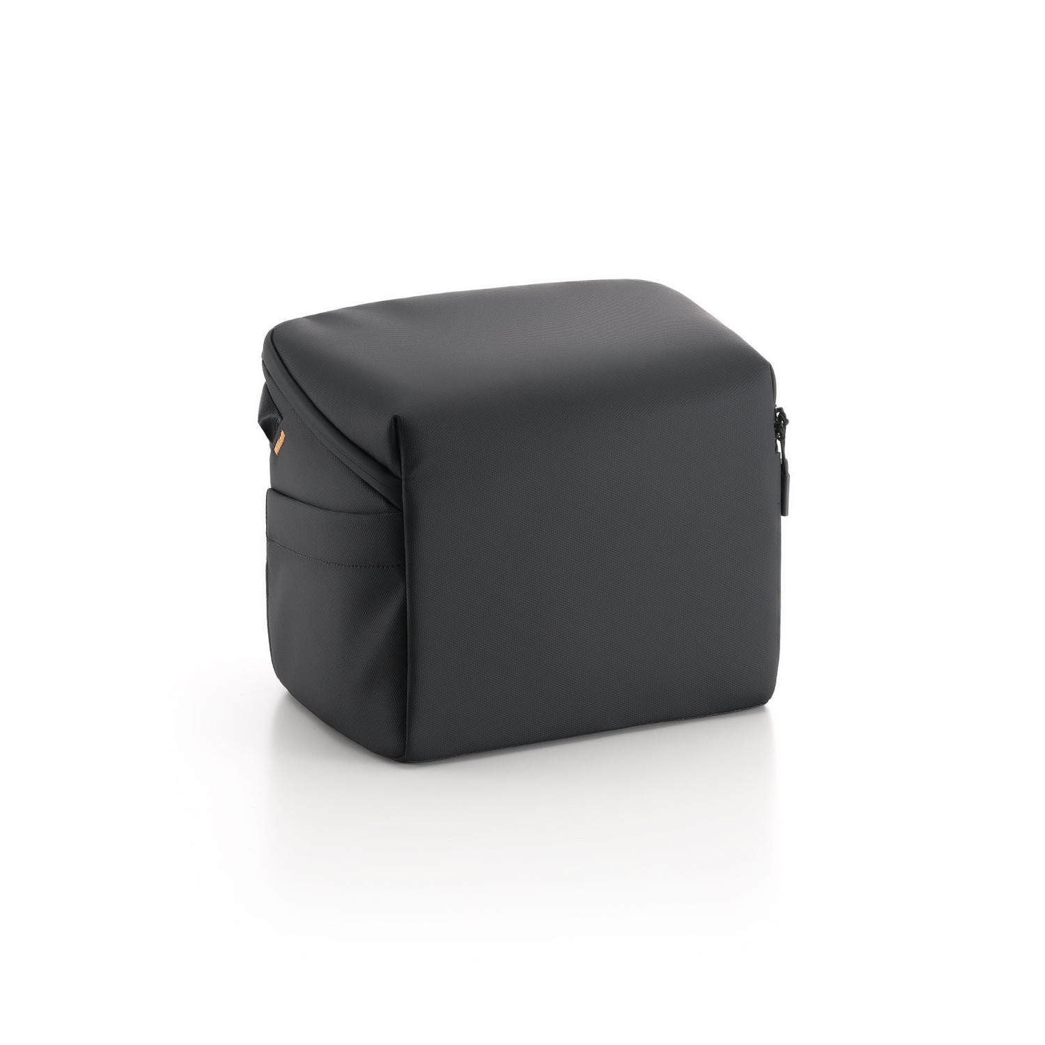 A black, cube-shaped camera bag on a white surface with a zipper and a handle.