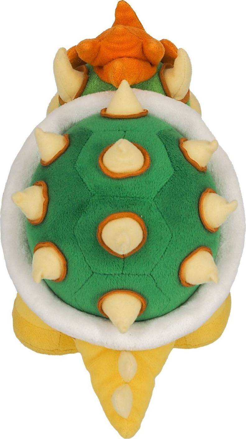 Peluche de Bowser vue de dessus, carapace verte à pointes jaunes, cheveux oranges.