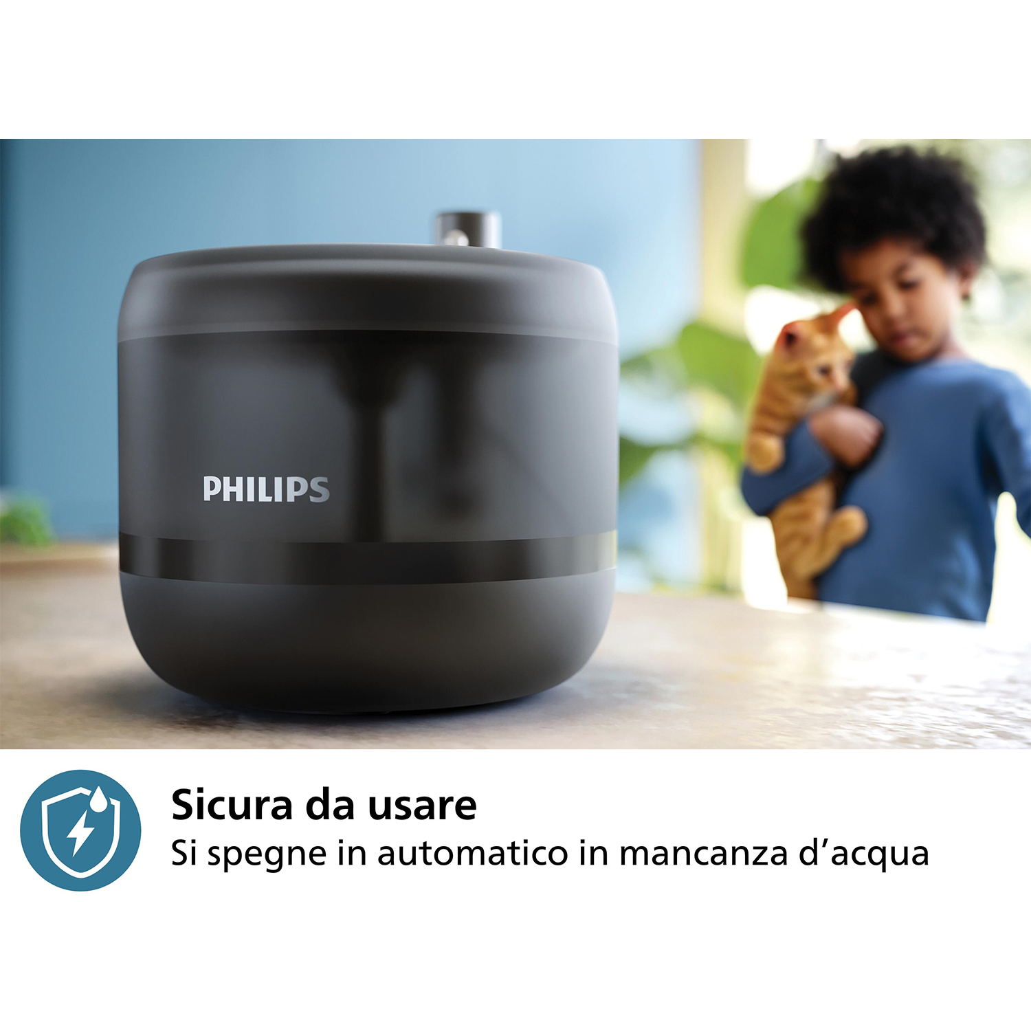 Umidificatore nero con logo Philips, bambino con gatto, testo.