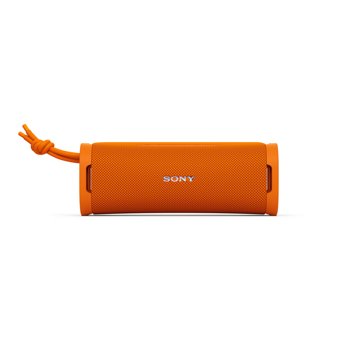 An orange Sony speaker on a white background. It has a mesh texture and a lanyard. The Sony logo is visible on the front.