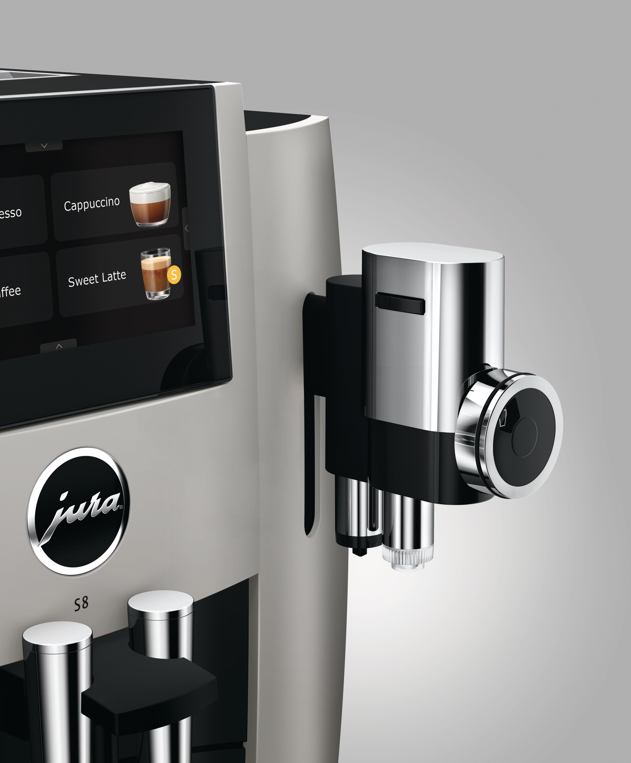 Nahaufnahme einer Kaffeemaschine mit silbernem Finish und Touchscreen.