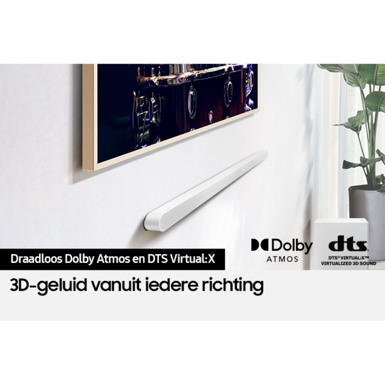 A white soundbar below a TV on a wall. Text reads 'Wireless Dolby Atmos and DTS Virtual:X'.