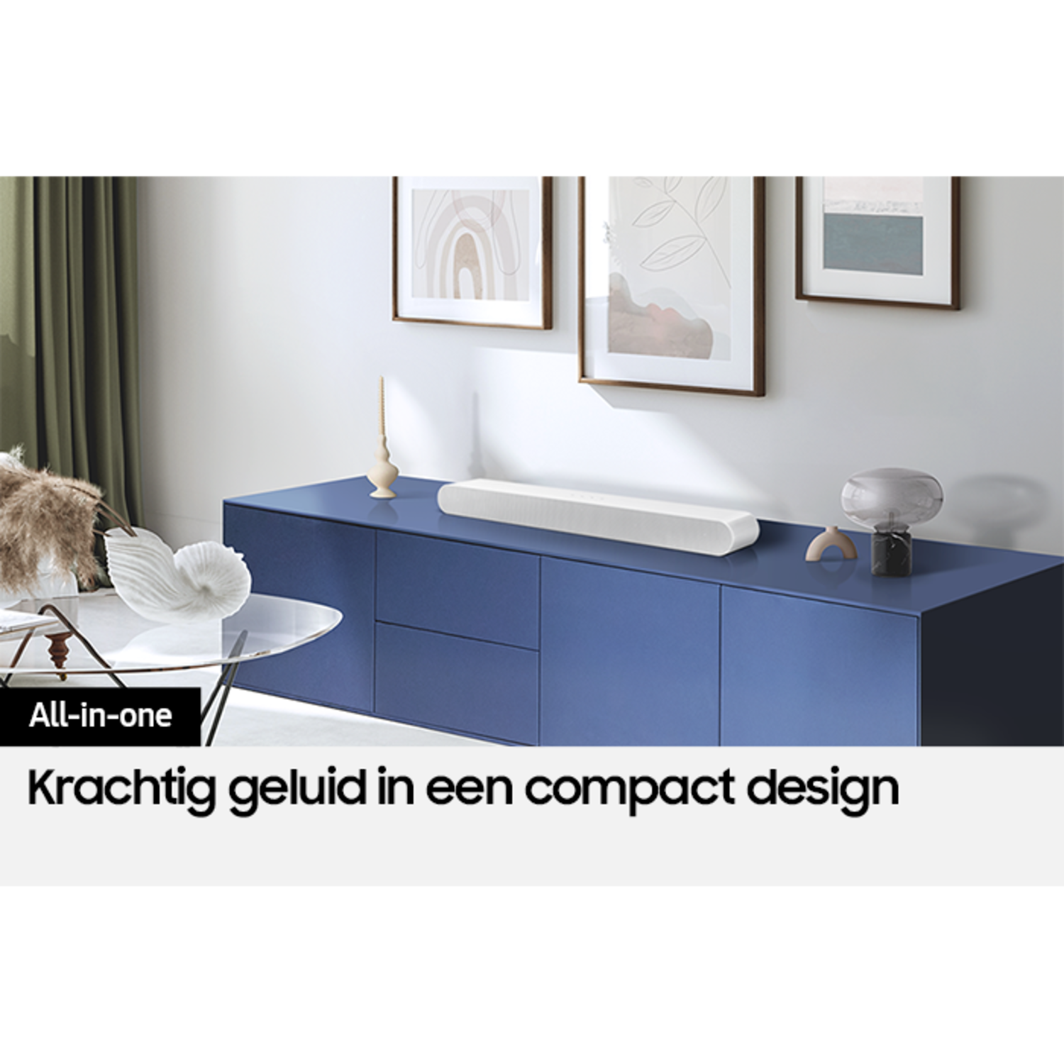 White soundbar on a blue cabinet, interior scene, with text.