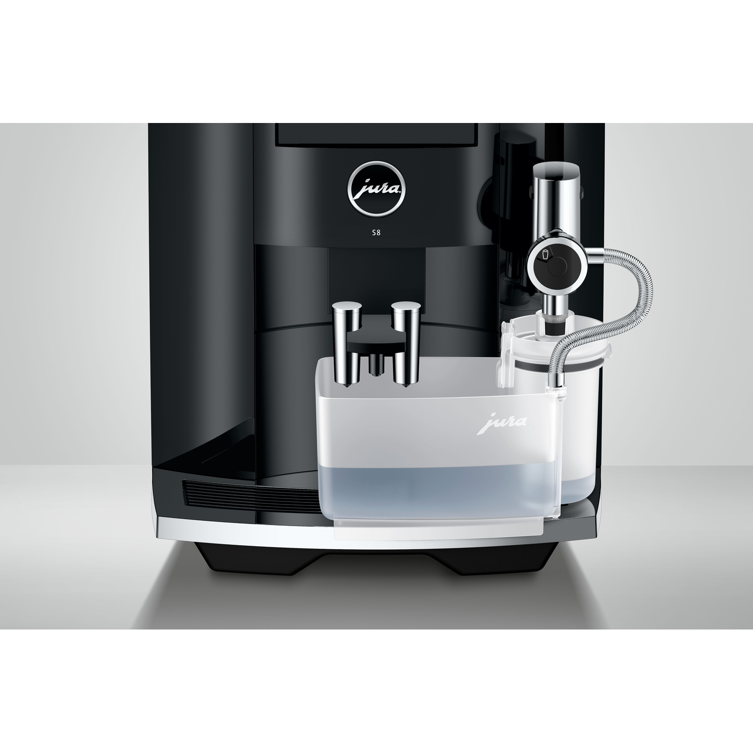 A close-up of a black Jura S8 coffee machine, highlighting the water tank and spout.