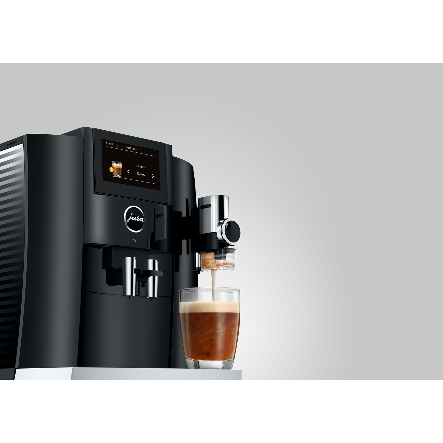 A black coffee machine pouring coffee into a glass.