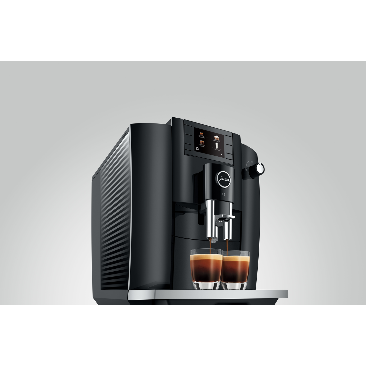 Black coffee machine with two glasses of espresso being poured.