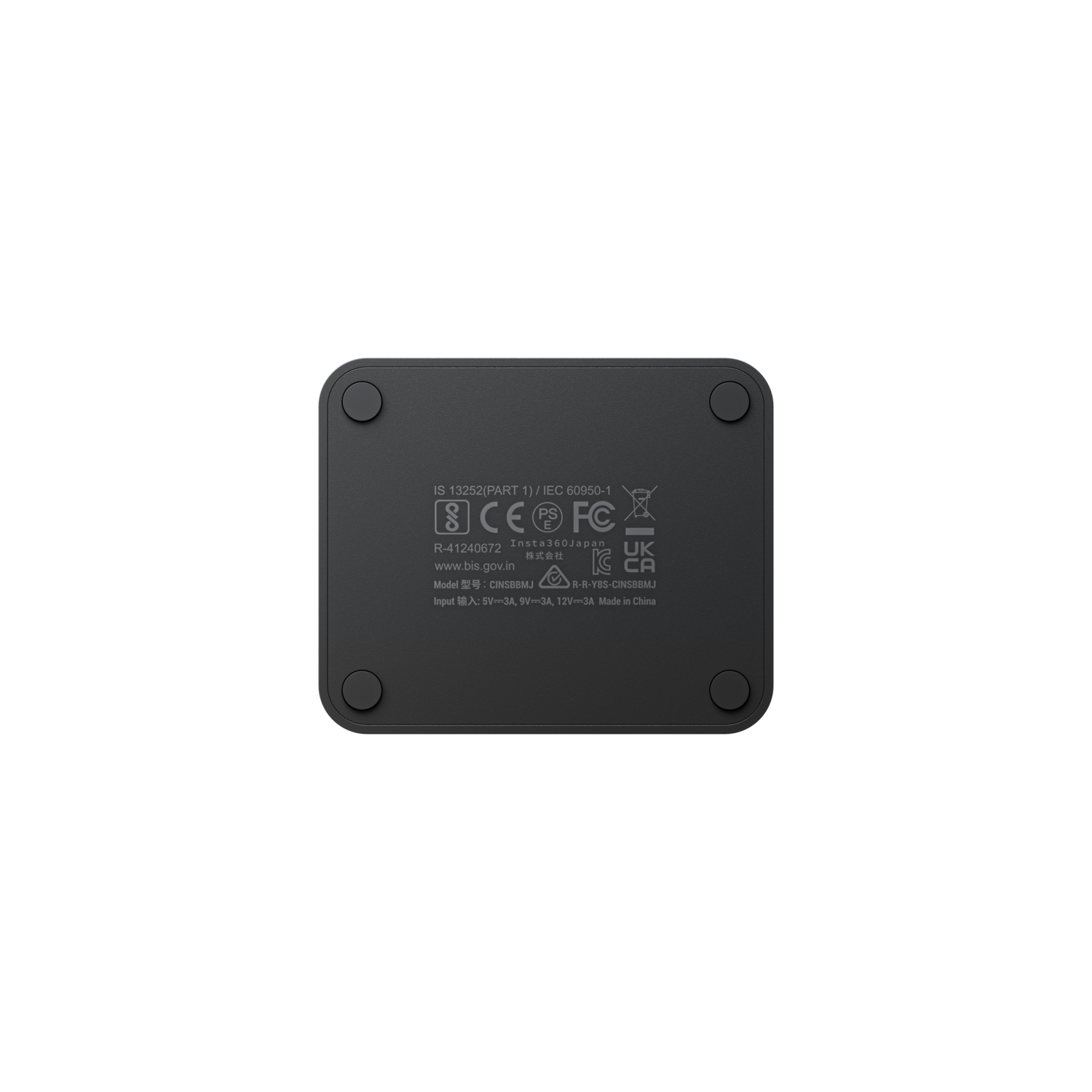 Black device underside, four rubber feet, various certifications and model info.