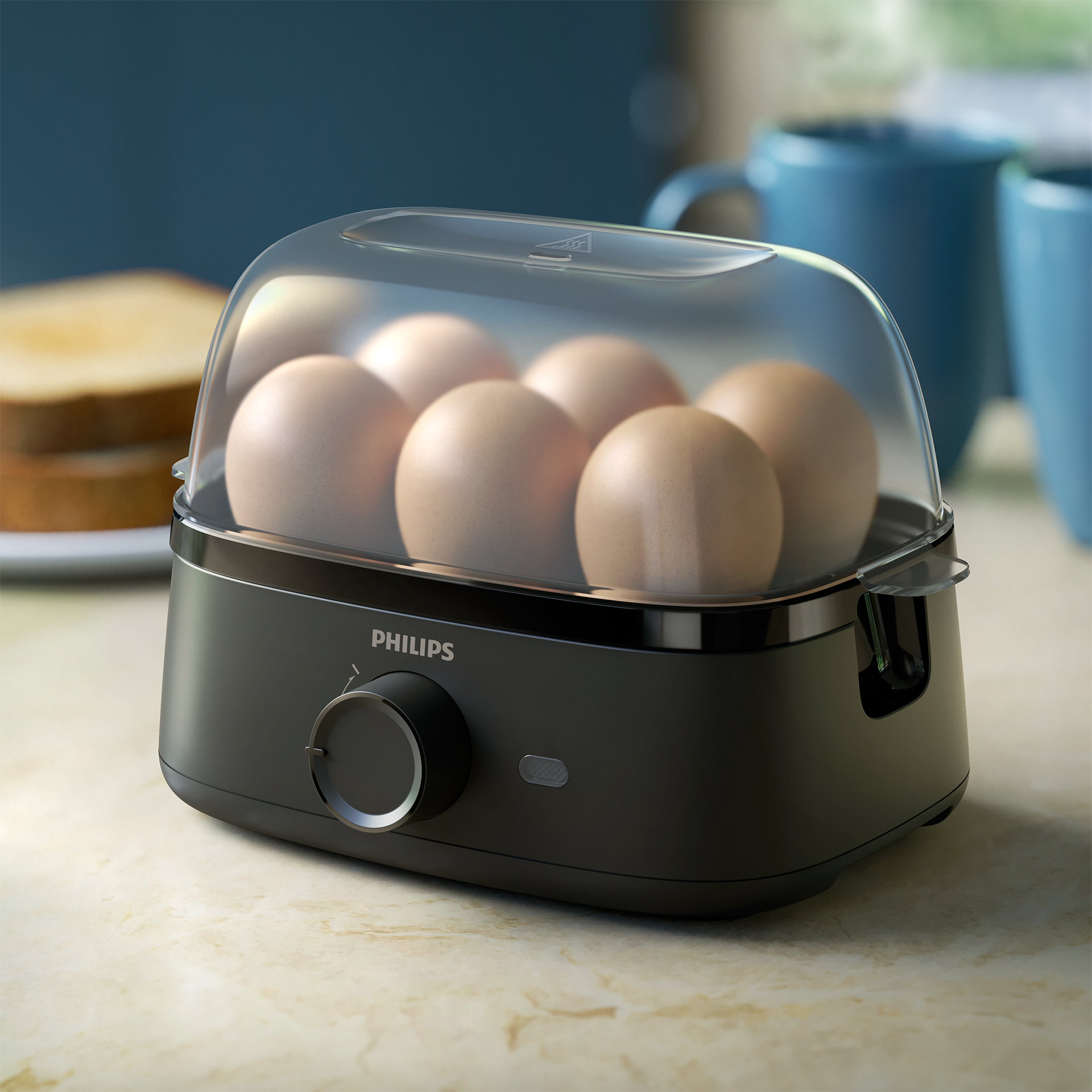 Hervidor de huevos con huevos dentro, negro, tapa transparente y dial.