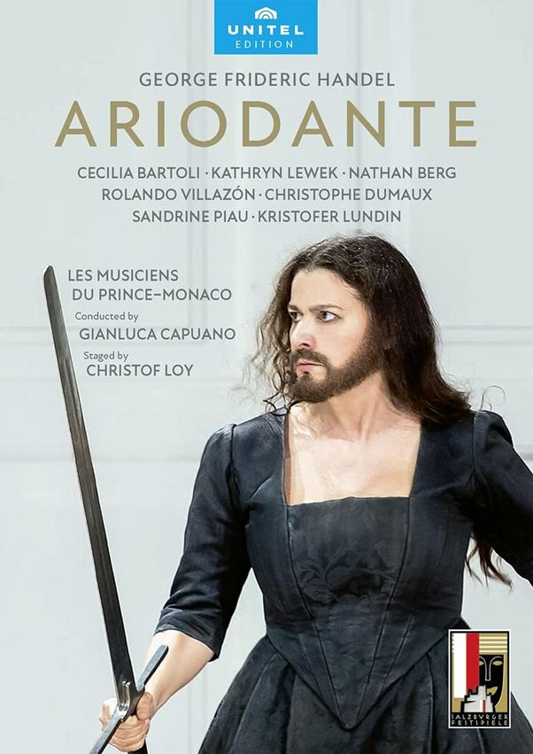 Opernplakat mit einem Mann, der ein Schwert hält, dem Titel 'Ariodante' und den Namen der Darsteller.