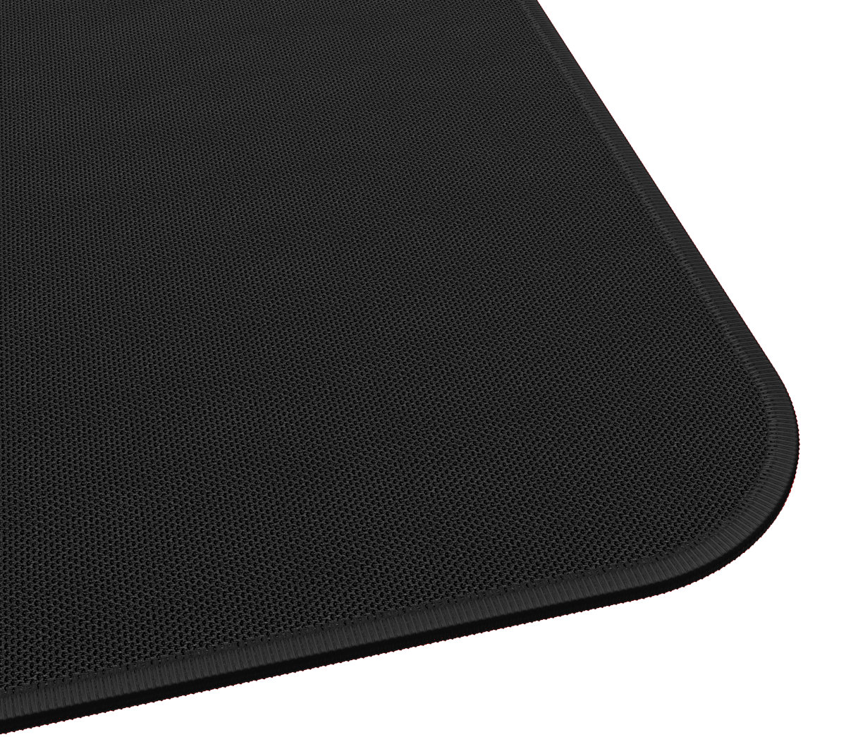 Zbliżenie czarnej maty, widok z rogu. Teksturowana powierzchnia, zaokrąglone krawędzie.
