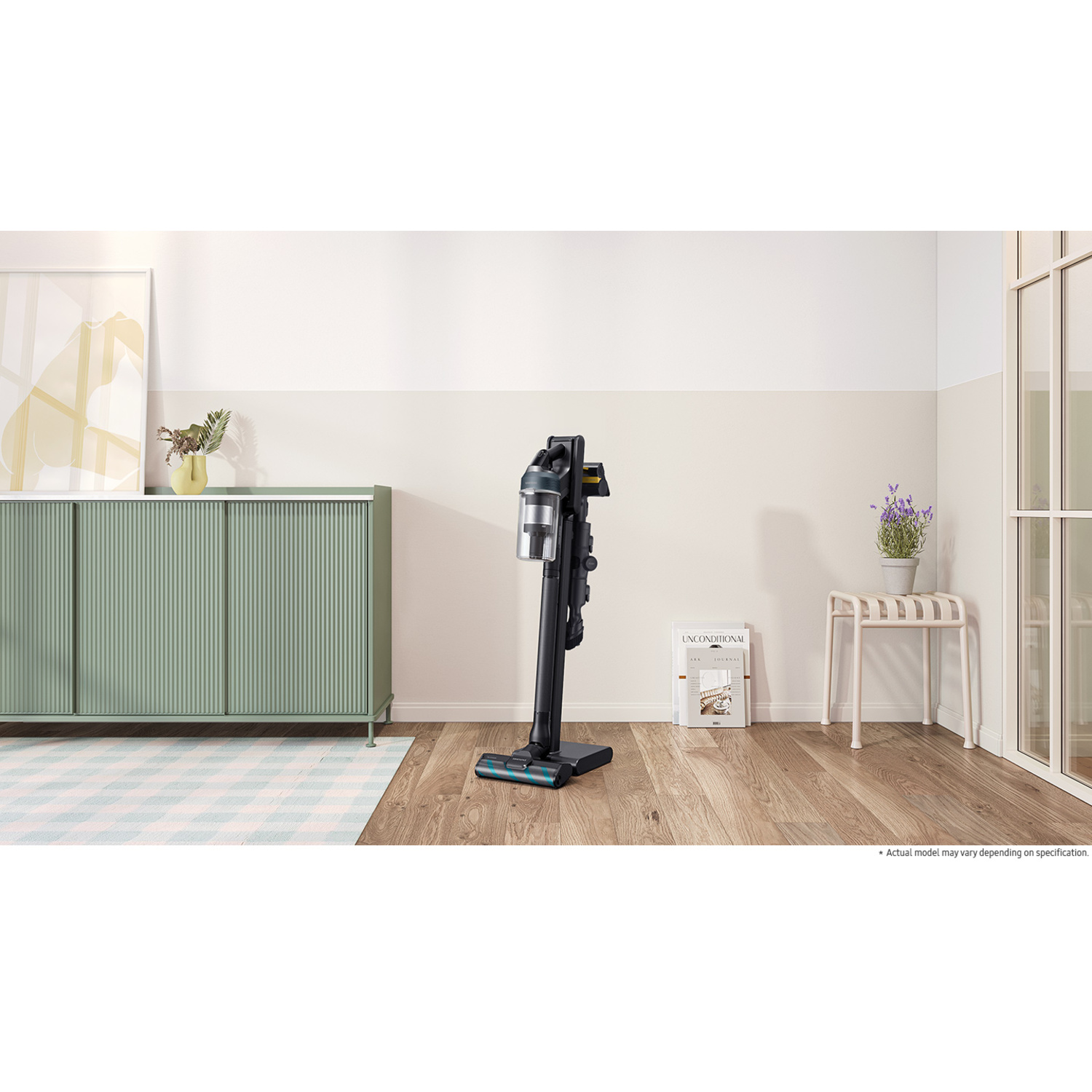 A black and silver cordless vacuum cleaner. Standing on a wooden floor. Light-colored walls and furniture.