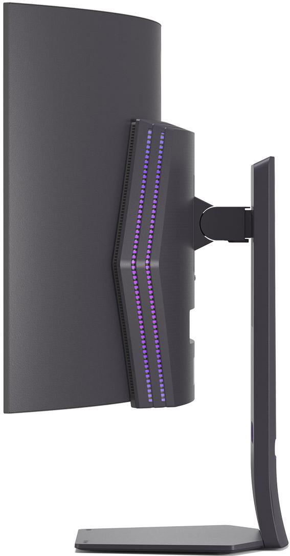 Seitenansicht eines schwarzen Monitors, lila Akzente auf der Rückseite, geschwungenes Design und ein Ständer.