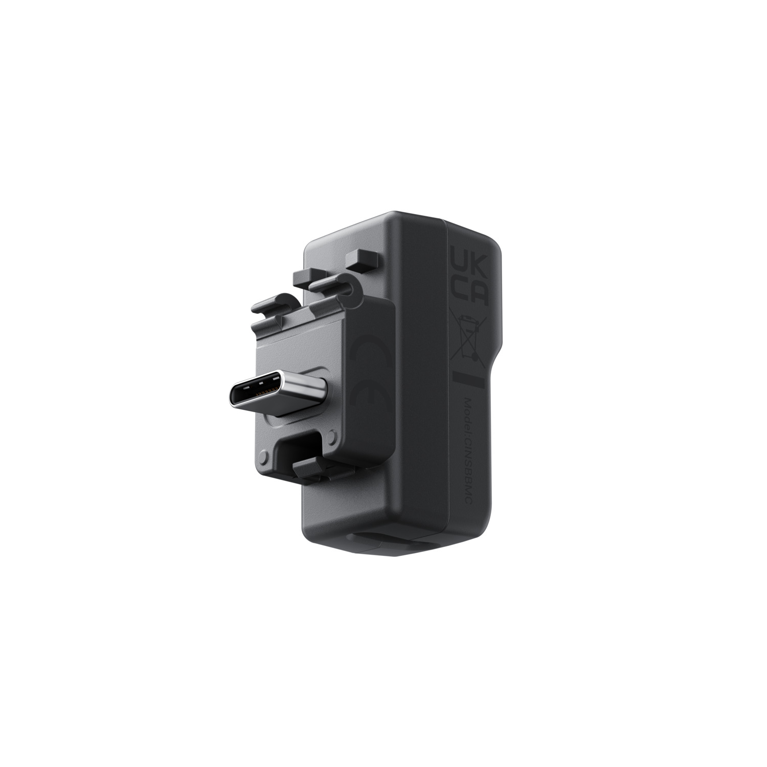 Un adaptateur noir rectangulaire avec port USB-C et marquages UK/CA.