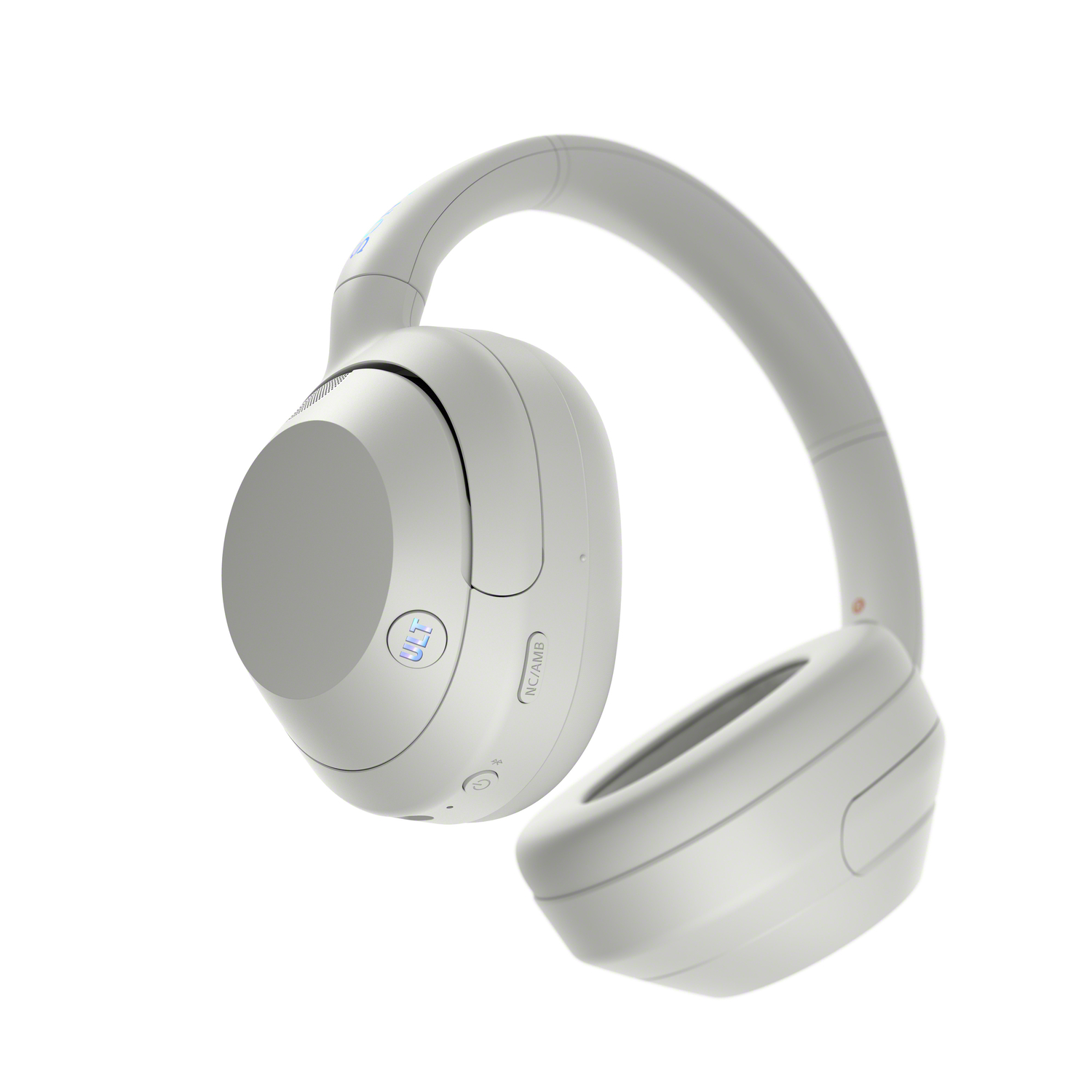 White headphones with a curved headband and earcups, with a few buttons and the label 'NC/AMBI' visible.