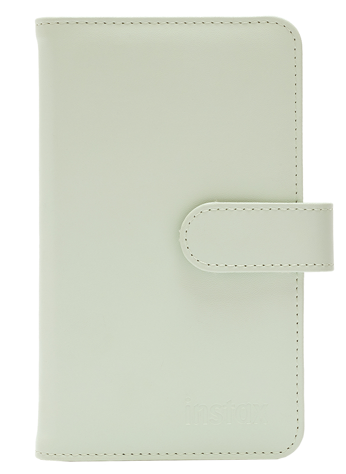 Jasnozielone etui na telefon Instax z zapięciem na guzik. Pastelowy kolor, prosty design, gładka powierzchnia.