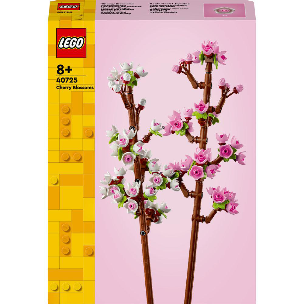 Eine LEGO-Box mit pinkfarbenem Hintergrund und Bildern von Kirschblütenzweigen. Die Box ist gelb und rot.