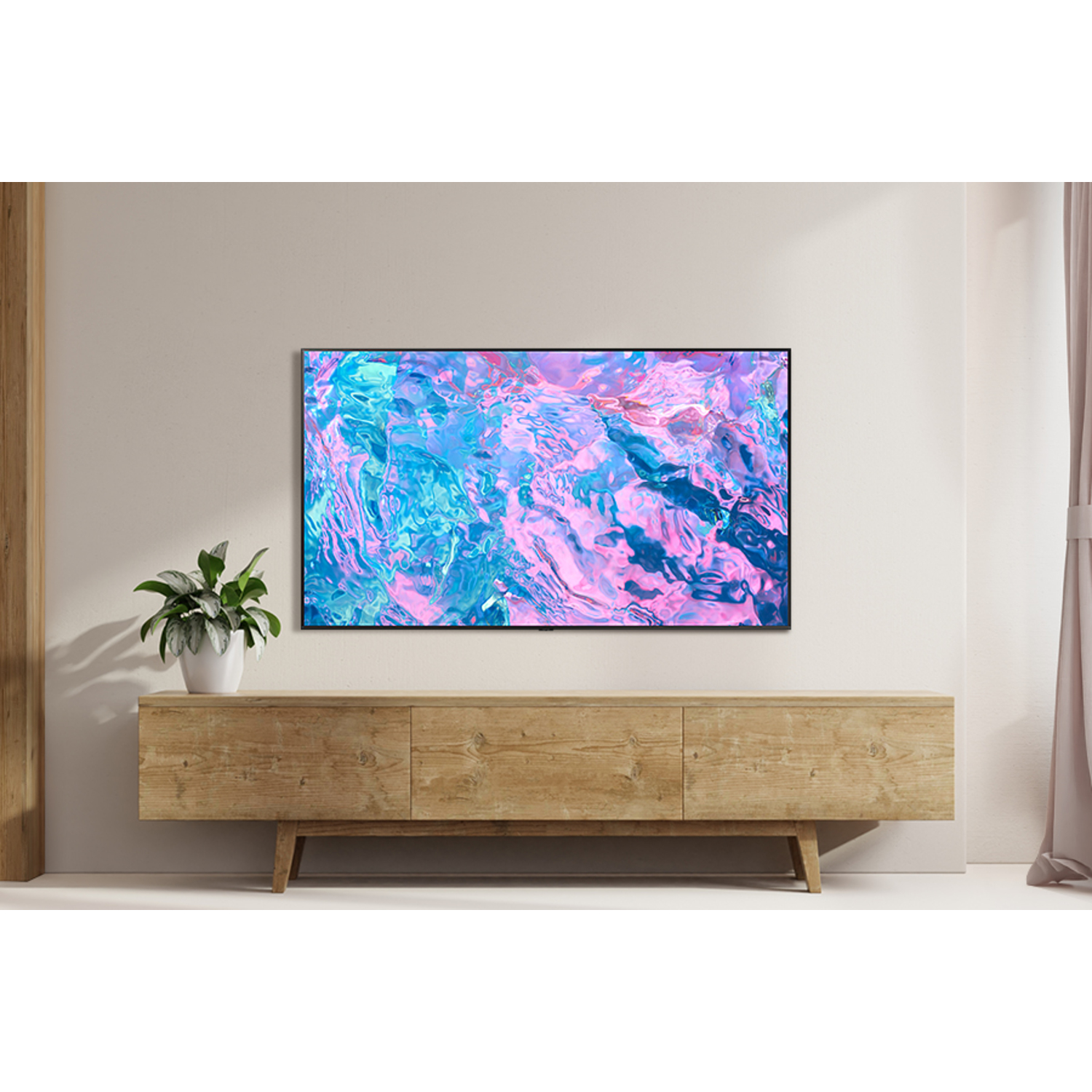 Een flatscreen tv toont een kleurrijk abstract beeld op een houten standaard.