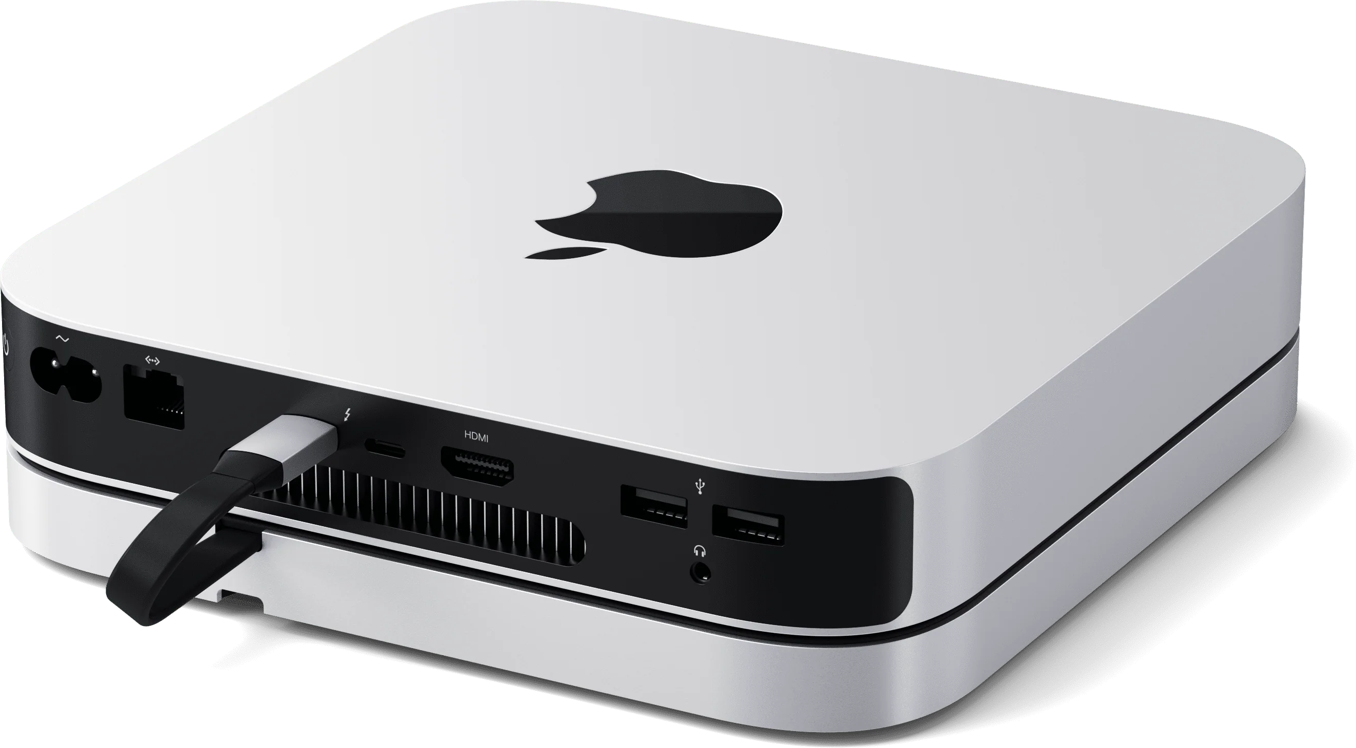 Weißer Apple Mac Mini, schwarzes Apple-Logo. Anschlüsse sichtbar. Silbernes Gehäuse mit abgerundeten Kanten.