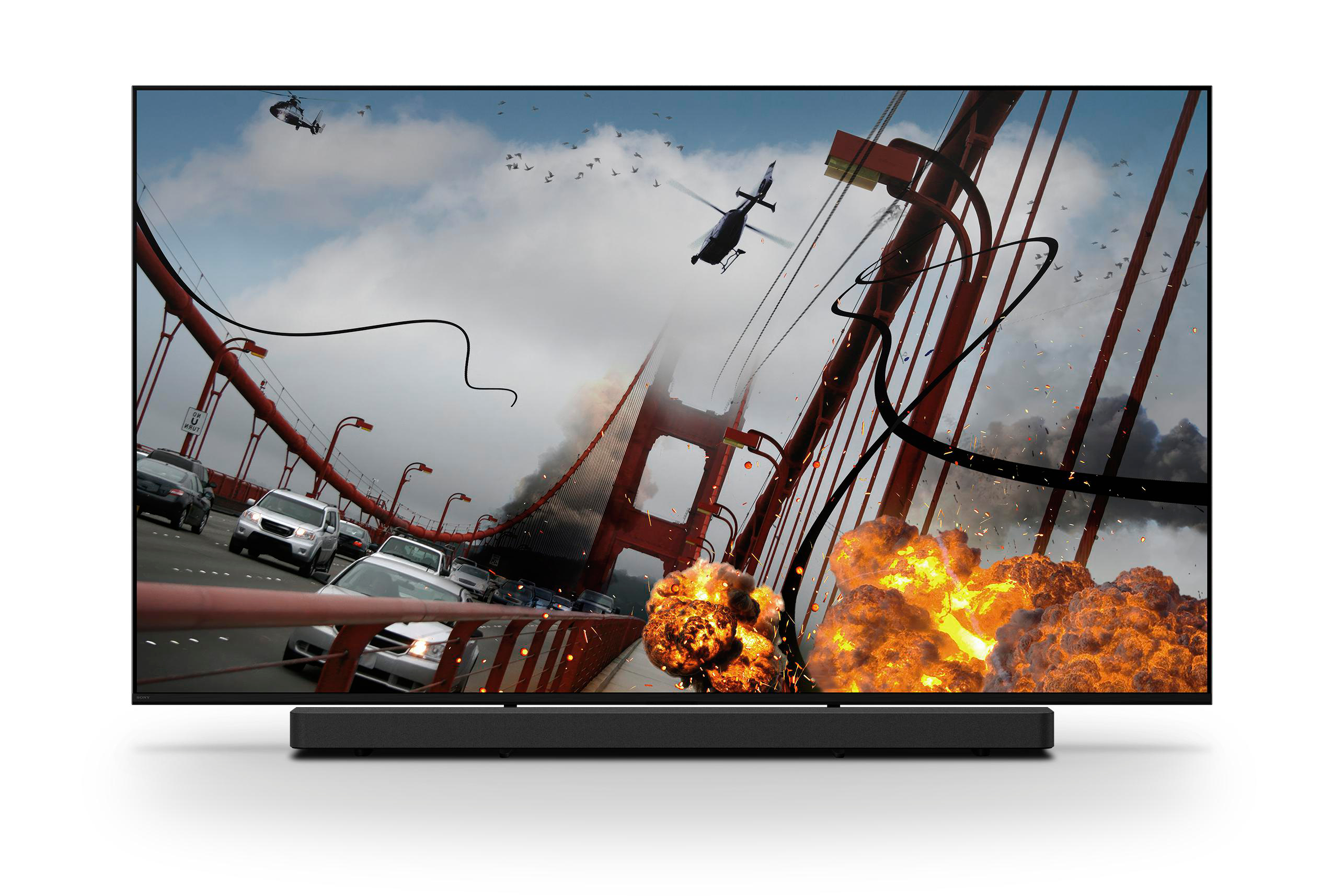 TV zeigt eine Explosion über einer Brücke mit Hubschraubern und Autos.