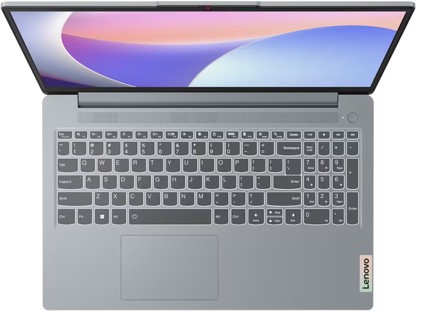 Draufsicht auf einen grauen Laptop mit Tastatur und offenem Bildschirm auf schwarzem Untergrund.