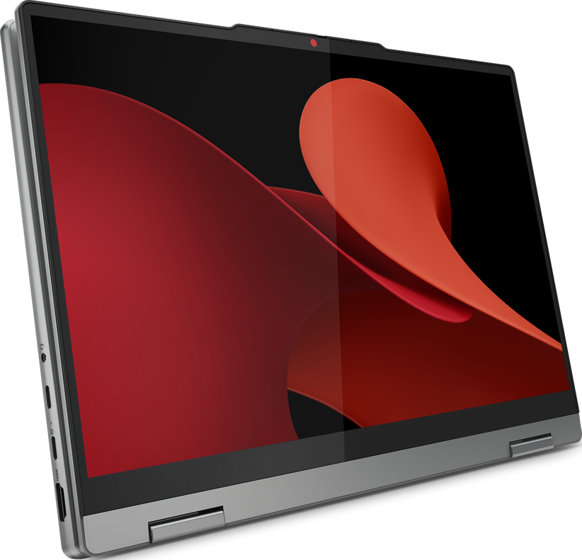 Laptop mit rotem, abstraktem Design auf dem Bildschirm. Silberner Rahmen, schwarzer Hintergrund.