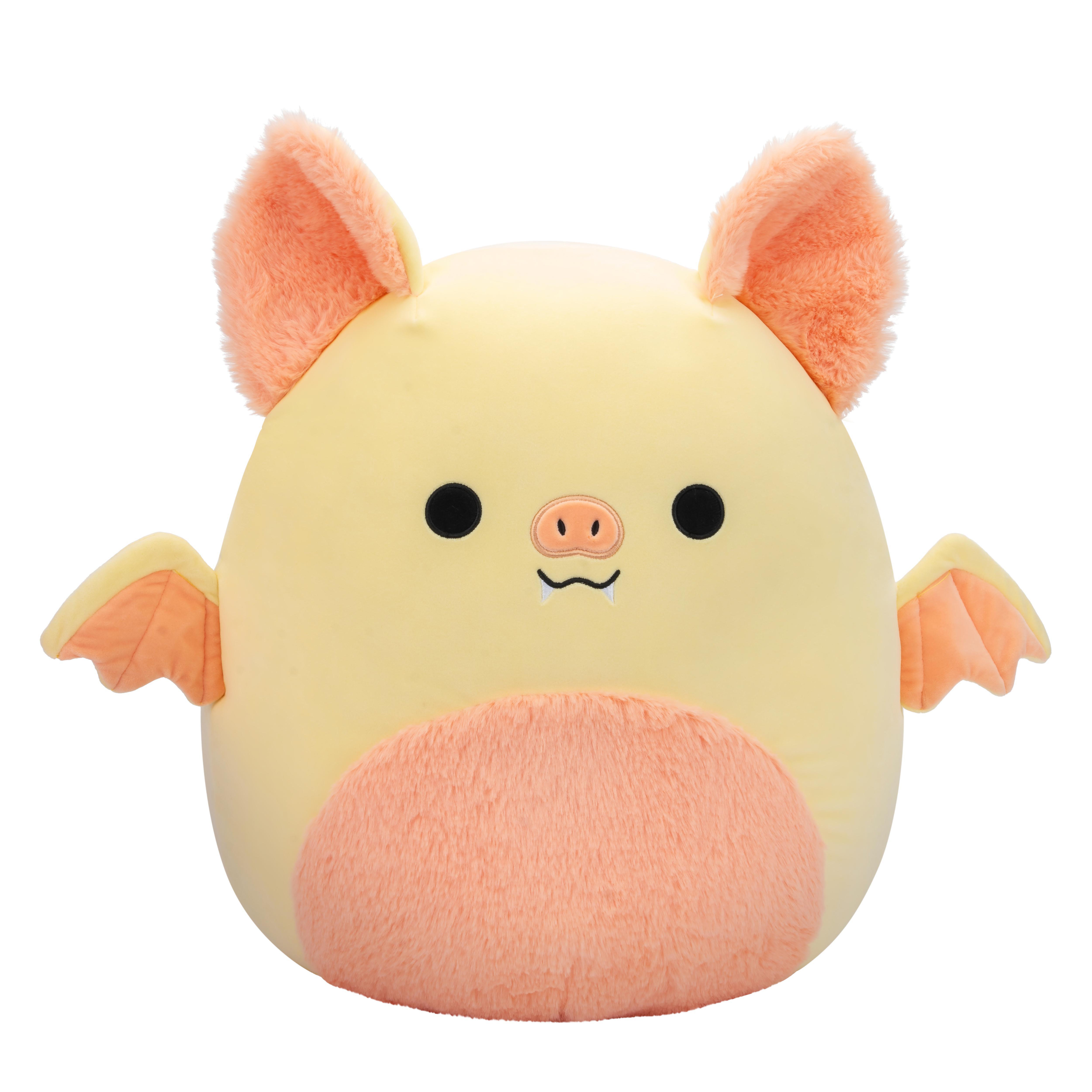 Gelbes Fledermaus-Plüschtier mit orangefarbenen Ohren, Flügeln und Bauch. Hat schwarze Augen und ein lächelndes Gesicht.