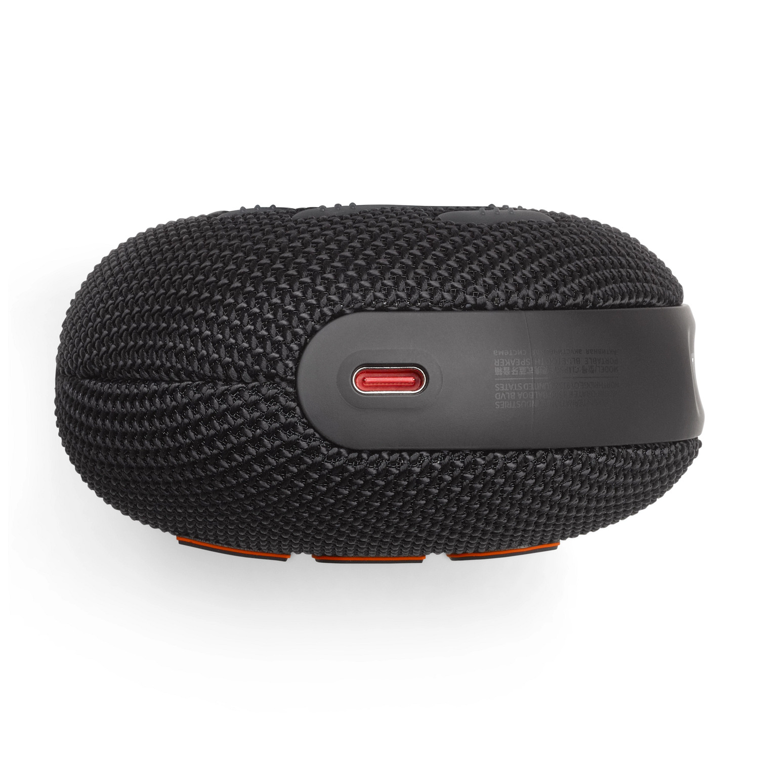 Haut-parleur noir avec une texture en mesh et des accents rouges. Vue de dessus.