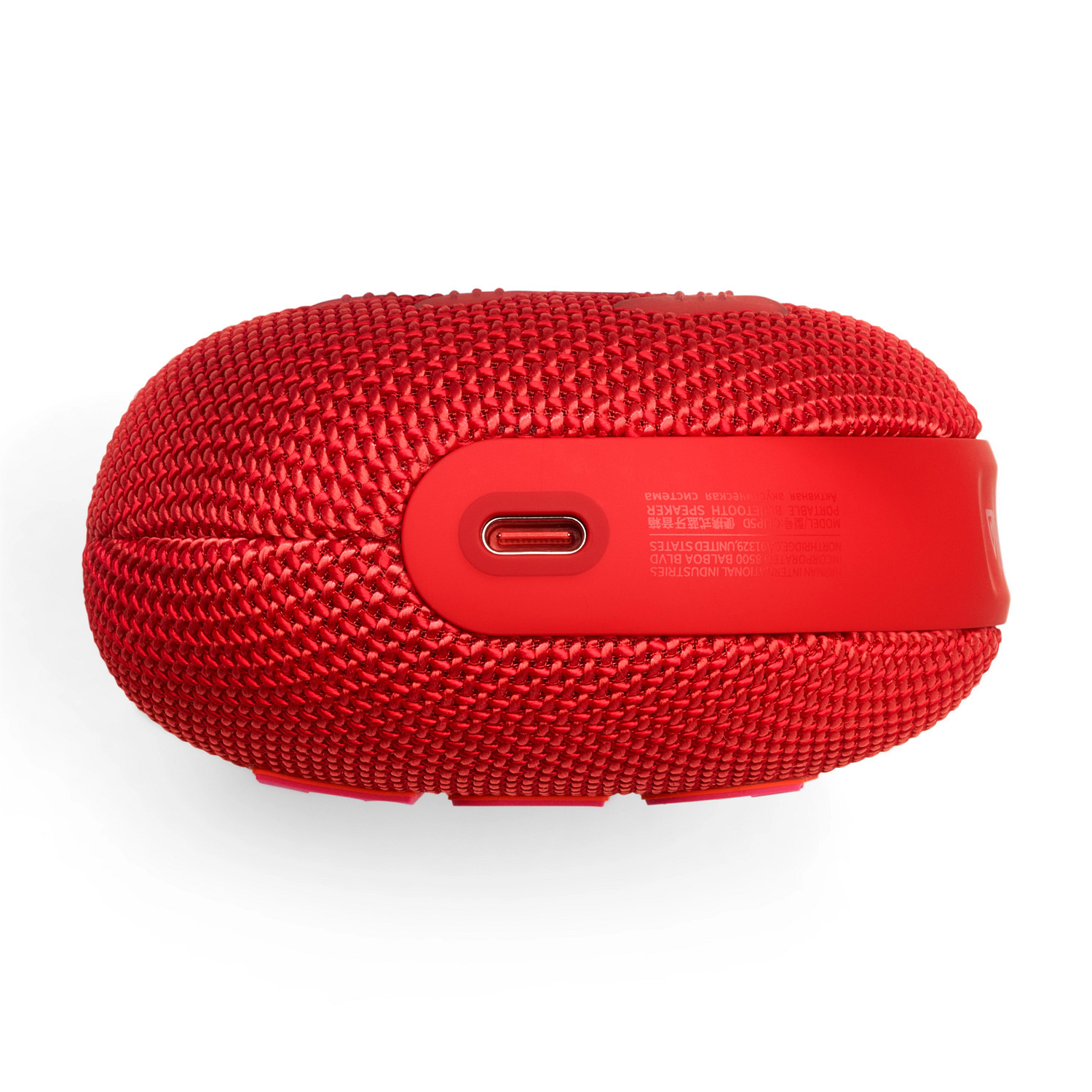 Haut-parleur Bluetooth rouge, ovale, avec port USB-C, sur fond blanc.