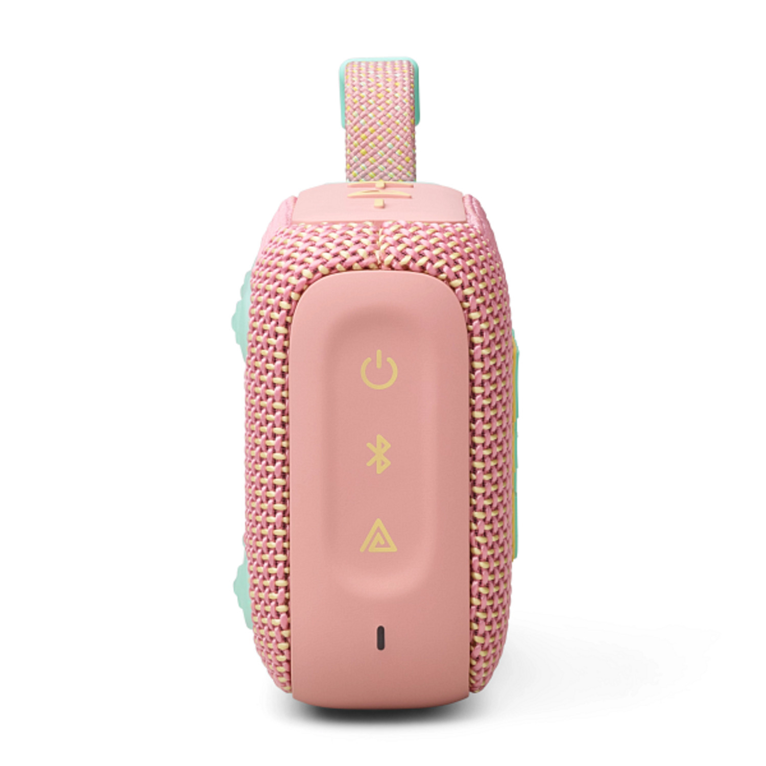 Een roze en lichtgroene luidspreker met knoppen en een handvat.