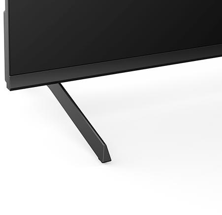 TV-láb közelképe, fekete és szögletes, fehér háttér előtt.