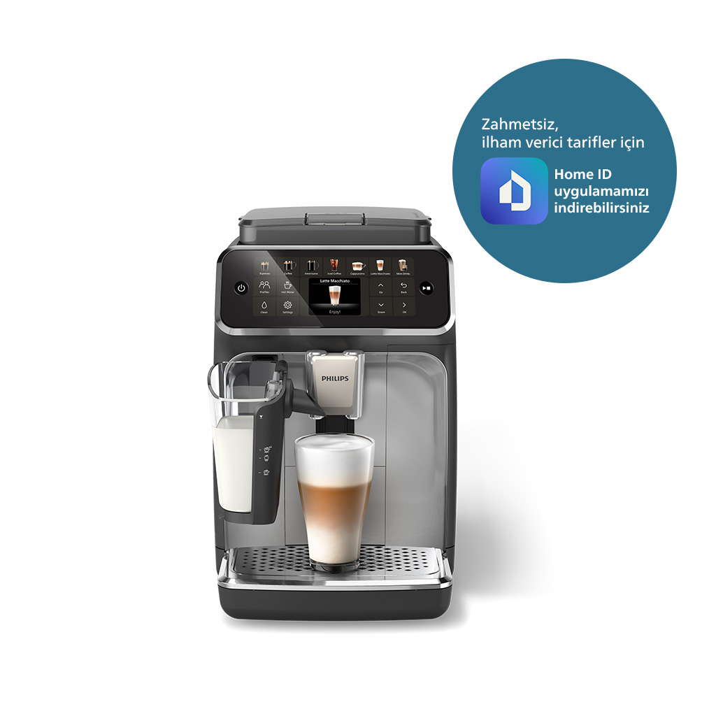 Siyah ve gümüş renkli Philips espresso makinesi latte yapıyor.