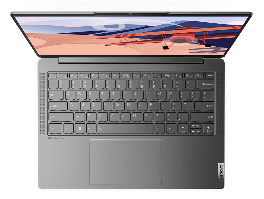 Widok z góry na laptopa ze zdjęciem samolotu na ekranie.