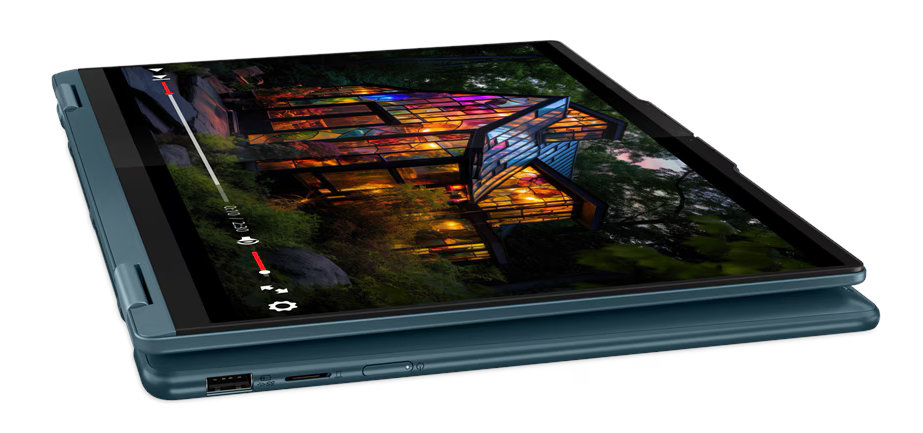 Tablet, otwarty, pokazujący wideo, z malowniczym tłem.