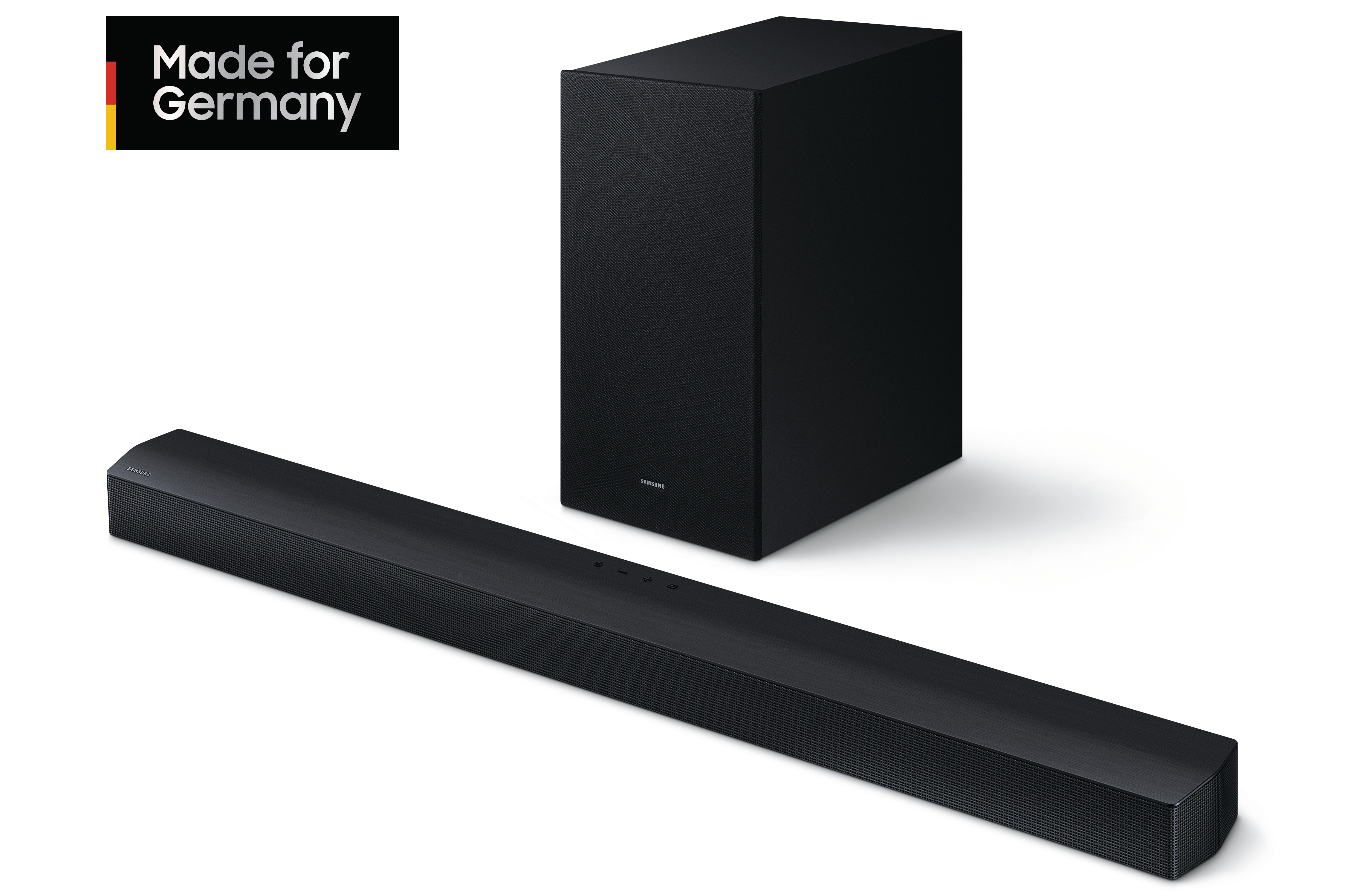 Schwarze Soundbar und Subwoofer. Text 'Made for Germany' in der oberen linken Ecke. Weißer Hintergrund.