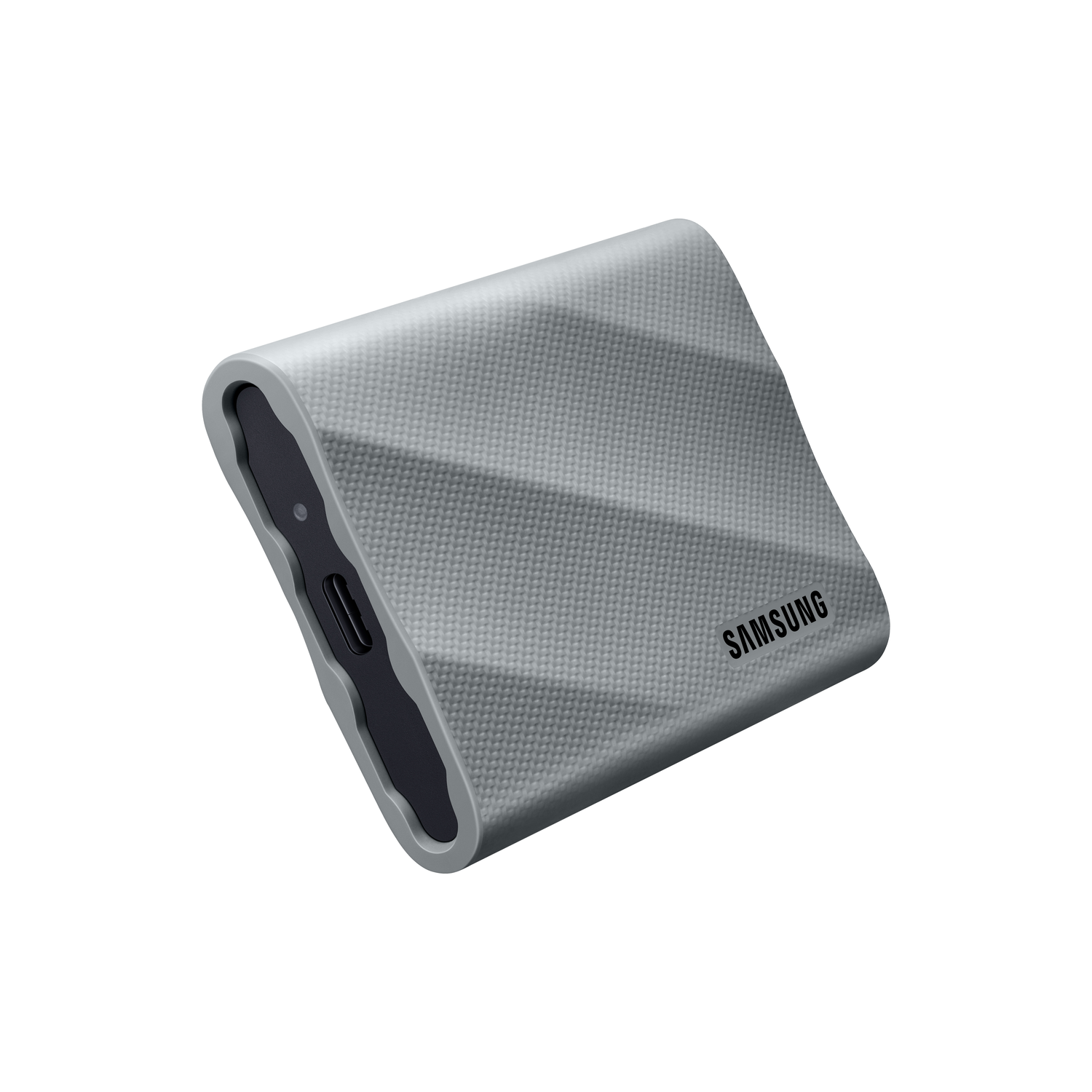 Silver, geometric-patterned portable hard drive. SAMSUNG label, black details, white background.