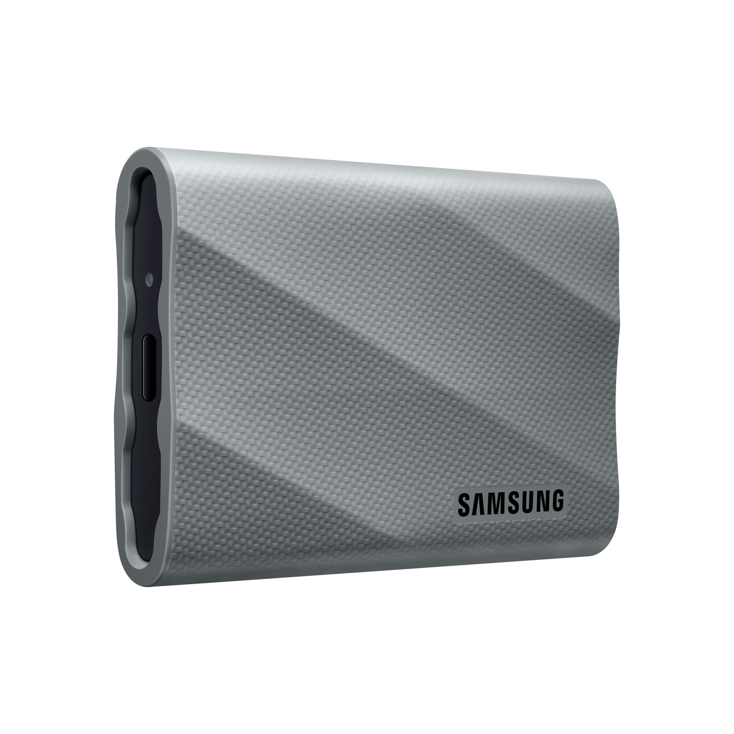A gray Samsung portable SSD with a textured surface. The Samsung logo is visible.