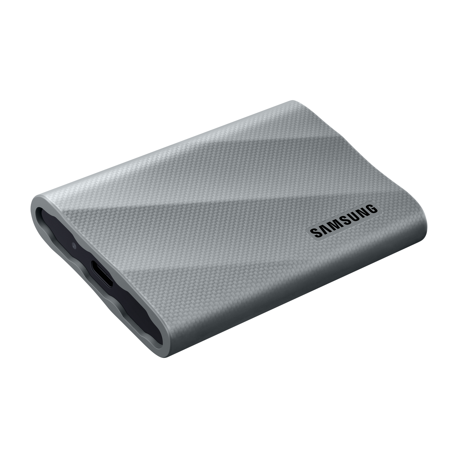 Gray, textured portable external hard drive. The Samsung logo is on the drive.
