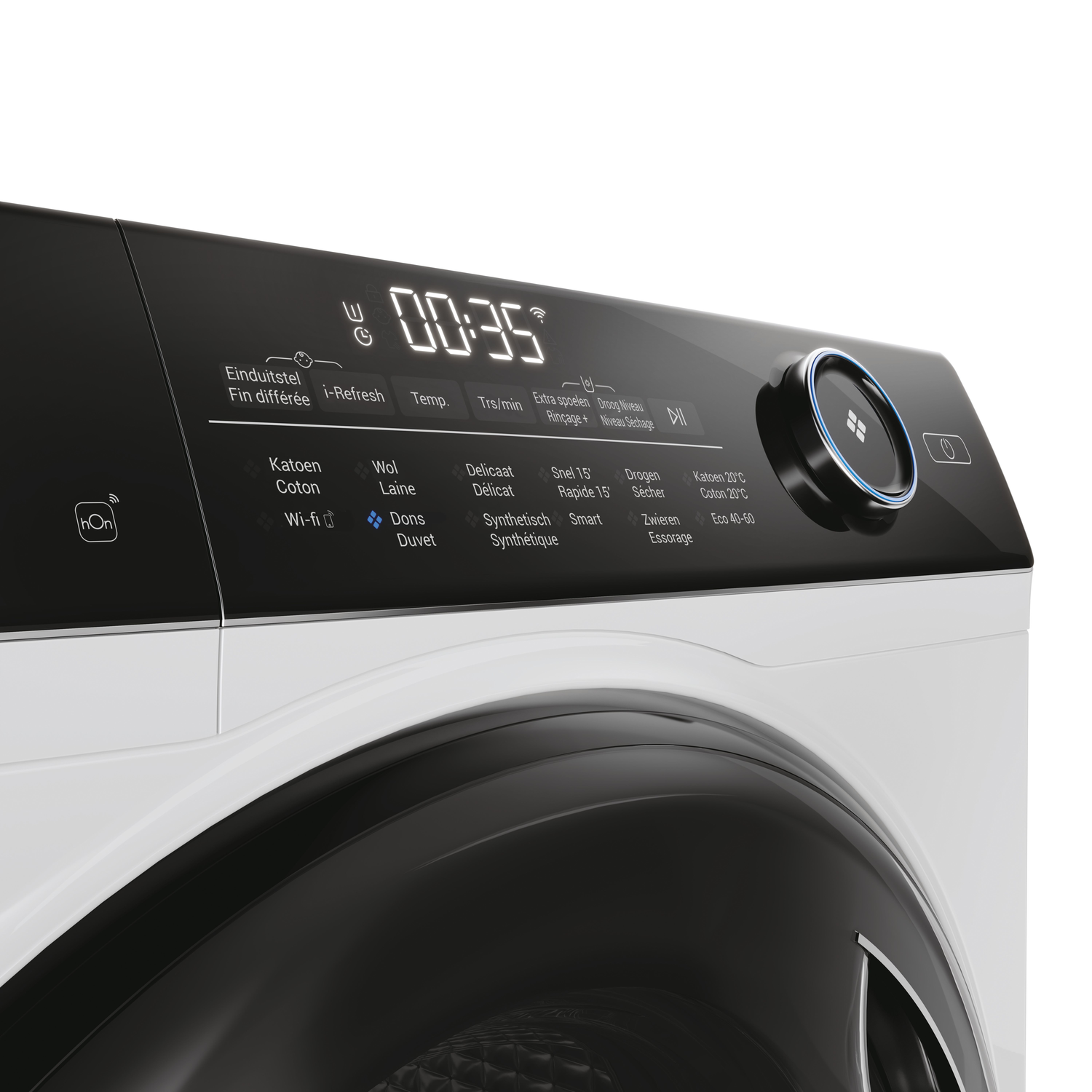 Close up of a white washing machine control panel with a digital display.