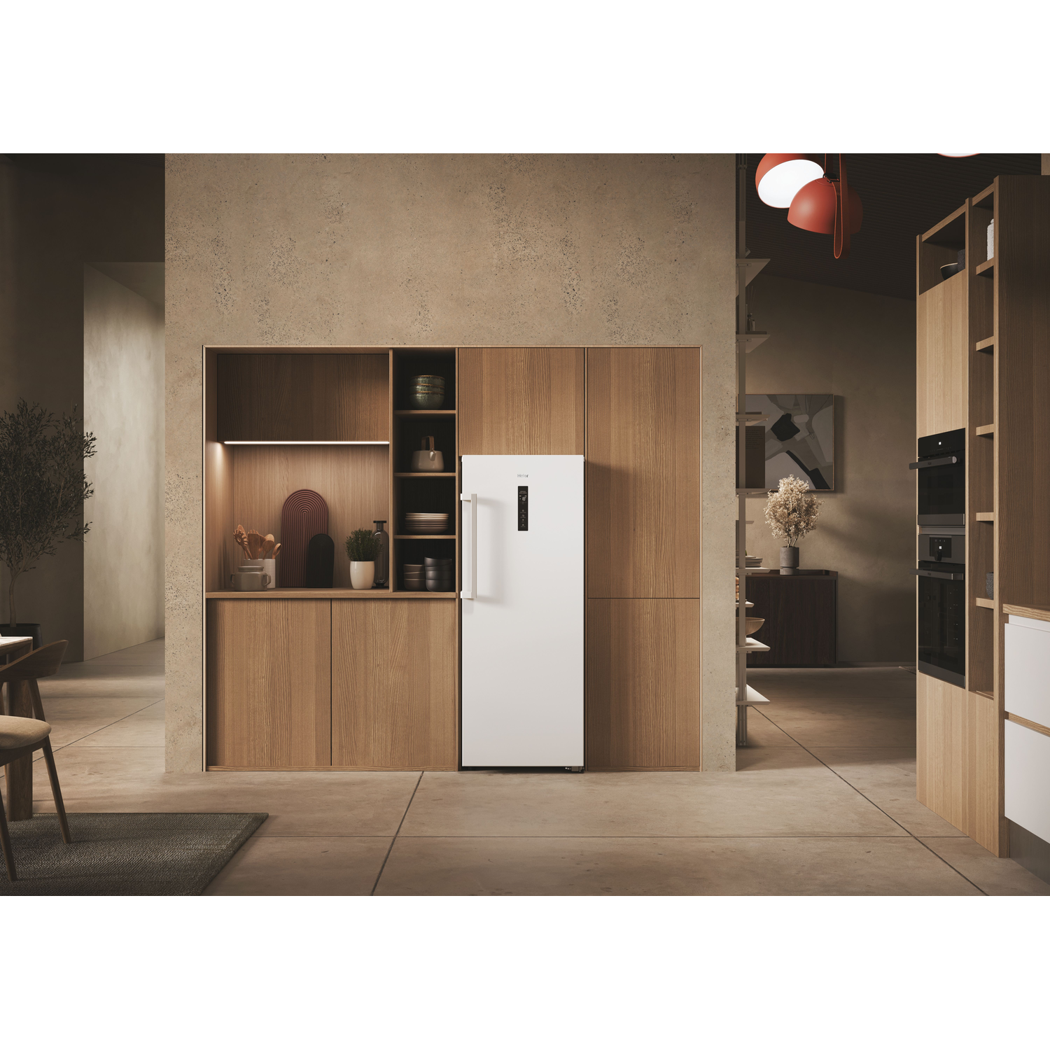 A white refrigerator stands in a modern kitchen with wooden cabinets and shelves.