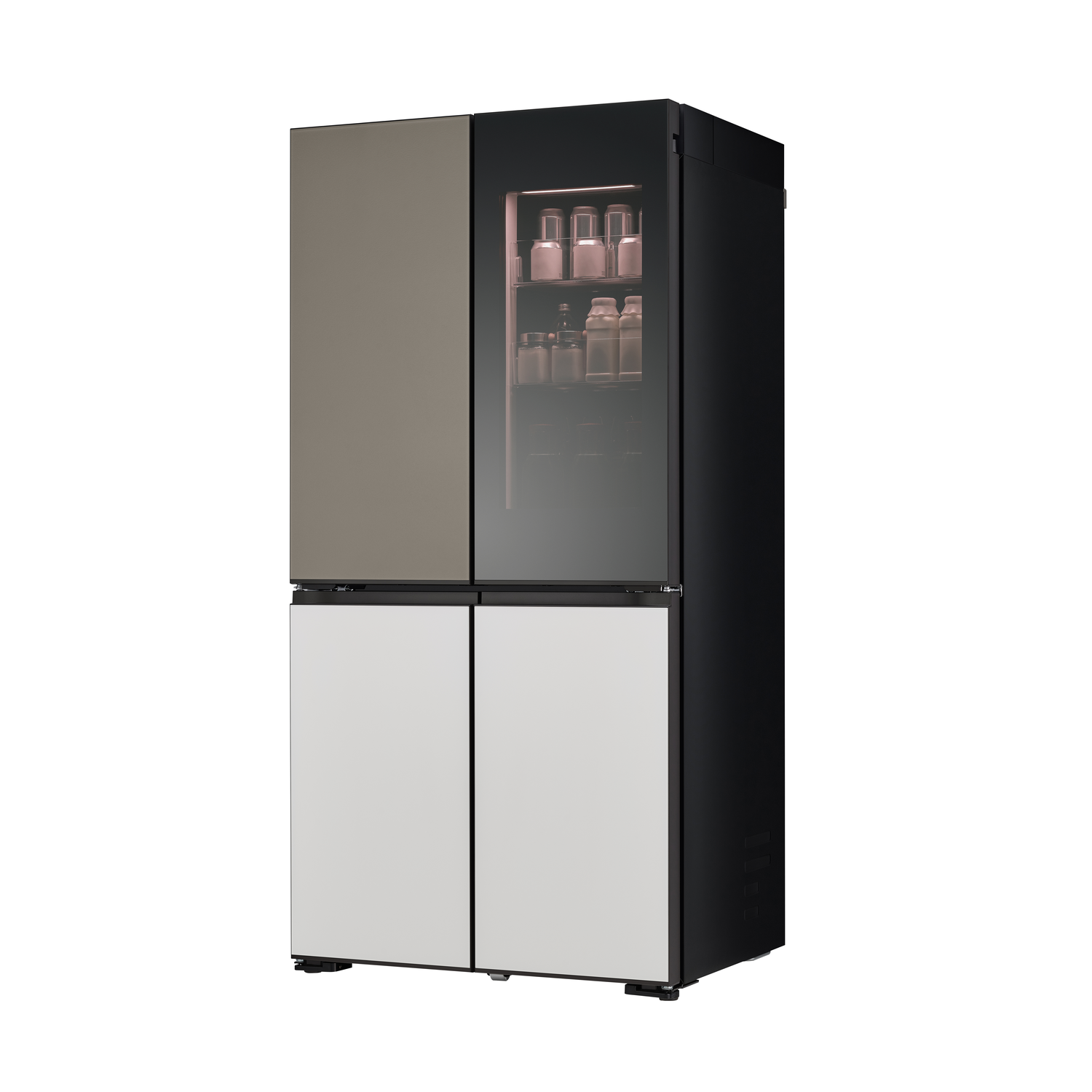 A modern, four-door refrigerator in a white room. 
