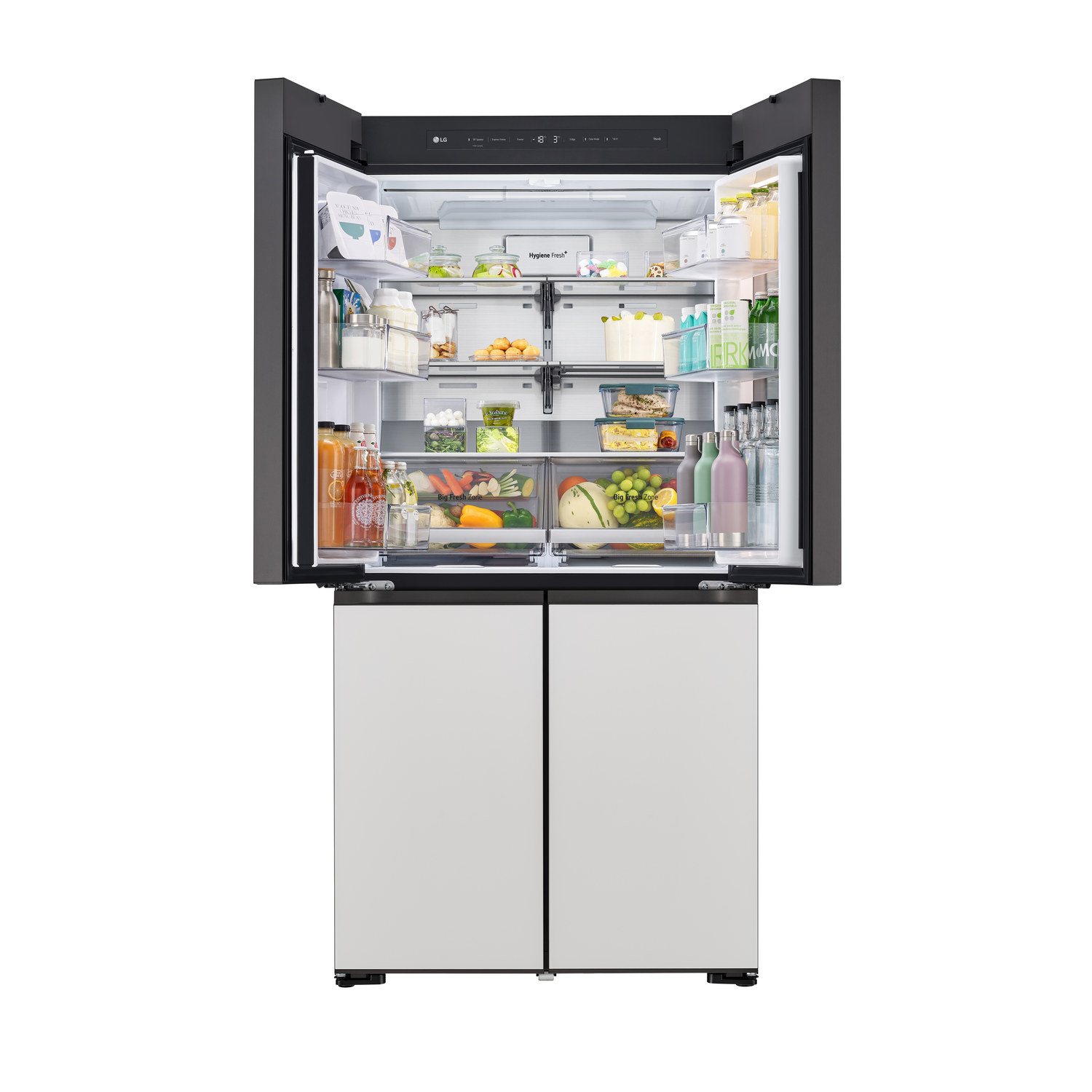 Open LG refrigerator showing shelves, drawers, and various food items inside.