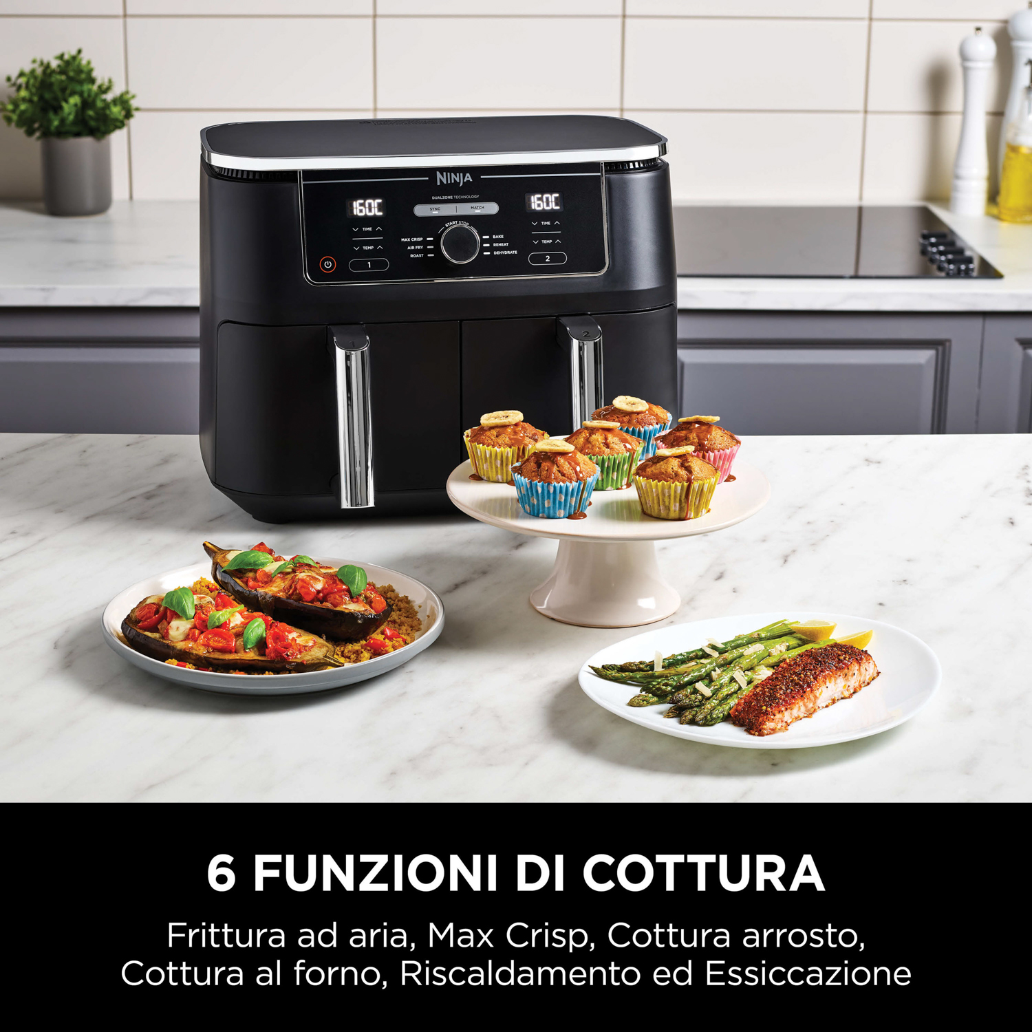 Una friggitrice ad aria con cibo su un tavolo. Include muffin, verdure grigliate e pesce.