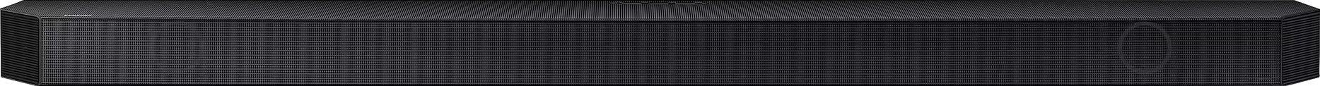 Une barre de son noire et longue avec une façade en mesh. Montée, probablement pour améliorer l'audio.