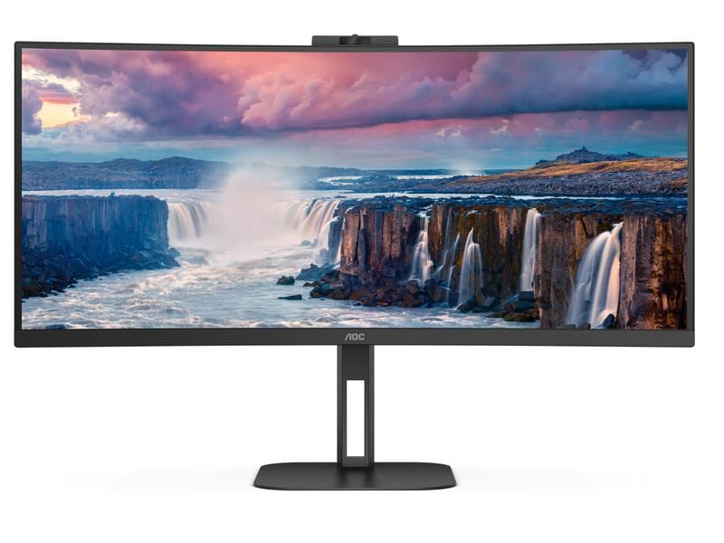 Monitor curvo che mostra una scena di cascata con nuvole e montagne.