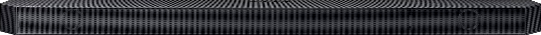Une barre de son noire avec une façade en mesh. Quelques petits logos sont visibles dessus.
