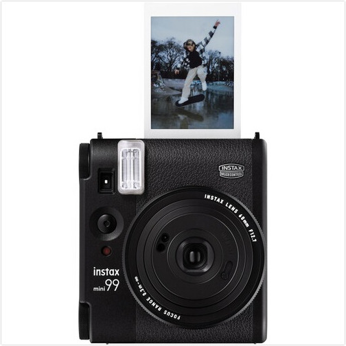 Black Instax Mini 99 camera with a photo. The photo shows a skateboarder in action.